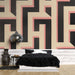 Papier peint géométrique avec motifs en relief noir et rose pour chambre moderne.
