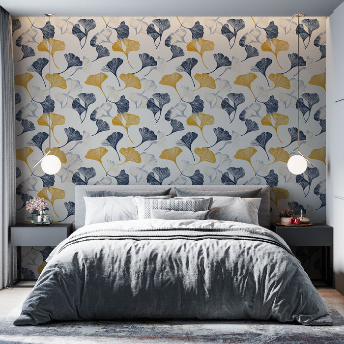 Une chambre moderne avec un papier peint aux motifs de feuilles de ginkgo en bleu, jaune et blanc, créant une atmosphère fraîche et apaisante.