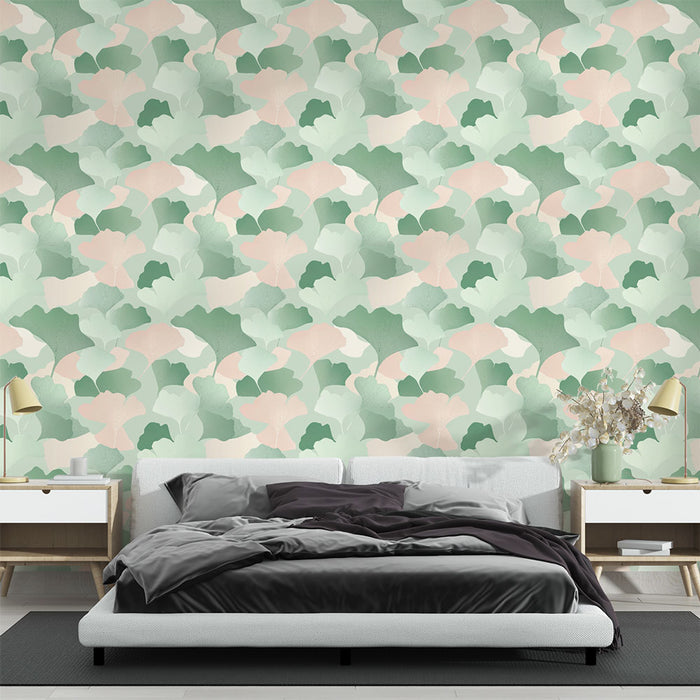 Une chambre moderne avec un papier peint aux motifs de feuilles stylisées en vert et rose, créant une atmosphère douce et apaisante.