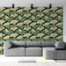 Un salon contemporain avec un papier peint aux motifs de feuilles de ginkgo dans des teintes vert foncé et beige, créant une atmosphère naturelle et apaisante.