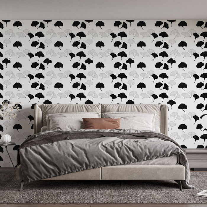Une chambre moderne avec un papier peint aux motifs de feuilles de ginkgo en noir et blanc, créant une atmosphère élégante et apaisante.
