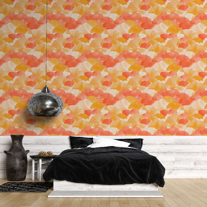 Une chambre moderne avec un papier peint aux motifs de feuilles de ginkgo en dégradé de rose, orange et jaune, créant une atmosphère chaleureuse et accueillante.