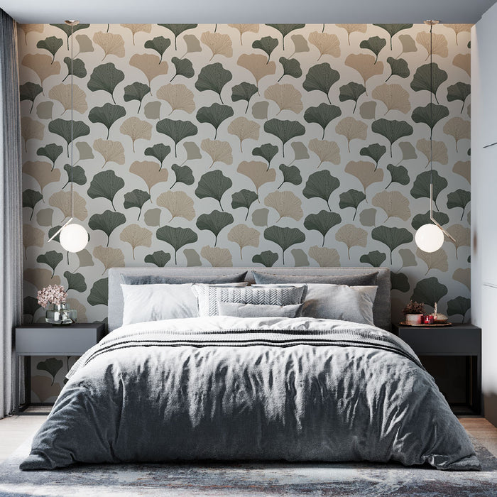 Une chambre moderne avec un papier peint aux motifs de feuilles de ginkgo dans des teintes de vert et beige, créant une atmosphère apaisante et naturelle.