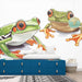 Papier peint grenouille avec illustrations colorées de grenouilles vibrantes pour chambre d'enfant.