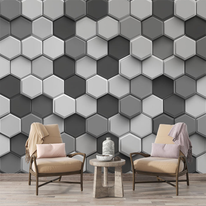 Un salon moderne avec un papier peint hexagonal en dégradé de gris, créant une ambiance élégante et contemporaine.