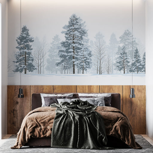 Une chambre moderne avec un papier peint représentant une forêt enneigée aux teintes douces, créant une atmosphère apaisante et hivernale.