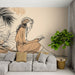 Une salle de séjour moderne avec un papier peint illustratif représentant une femme lisant, entourée de feuillages stylisés, créant une atmosphère douce et contemplative.