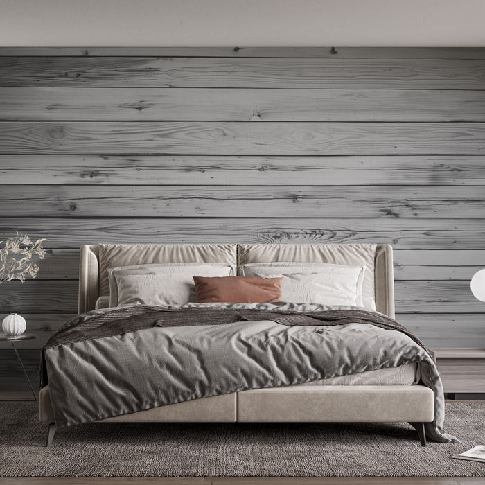 Une chambre moderne avec un papier peint imitation bois gris, créant une ambiance chaleureuse et naturelle, idéale pour la détente.