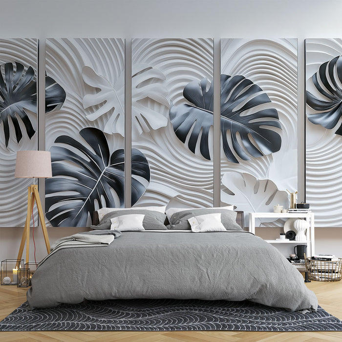 Une chambre moderne avec un papier peint en relief représentant des feuilles de monstera en nuances de gris sur un fond texturé, créant une ambiance élégante et apaisante.