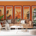 Un salon chaleureux avec un papier peint illustrant des paysages montagneux orange et doré, créant une atmosphère apaisante et artistique.