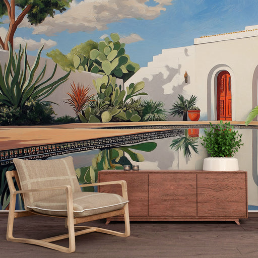 Une pièce lumineuse avec un papier peint mural représentant un paysage méditerranéen coloré, évoquant une ambiance relaxante et estivale.