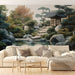 Un salon élégant avec un papier peint représentant un paysage asiatique apaisant, où se mêlent arbres, rochers et un pavillon, créant une atmosphère sereine et naturelle.