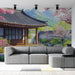 Une pièce moderne avec un papier peint représentant un paysage asiatique, mêlant fleurs de cerisier et architecture traditionnelle, créant une atmosphère sereine et apaisante.
