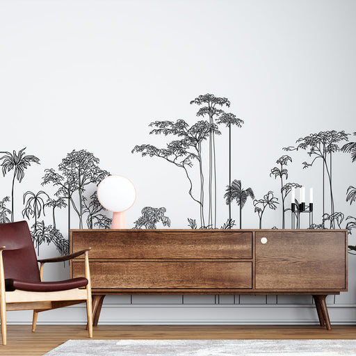 Une pièce moderne avec un papier peint représentant des silhouettes de plantes tropicales en noir sur fond blanc, créant une ambiance artistique et épurée.