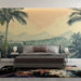 Une chambre moderne avec un papier peint tropical représentant des palmiers et des montagnes sur fond dégradé beige, créant une atmosphère apaisante et chaleureuse.