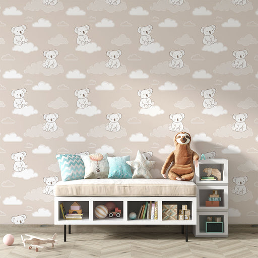 Une chambre d'enfant avec un papier peint doux représentant des ours en peluche sur des nuages, créant une atmosphère chaleureuse et ludique.