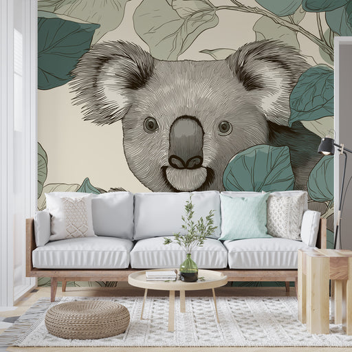 Un salon lumineux avec un papier peint illustrant un koala entouré de feuilles, créant une ambiance naturelle et chaleureuse.