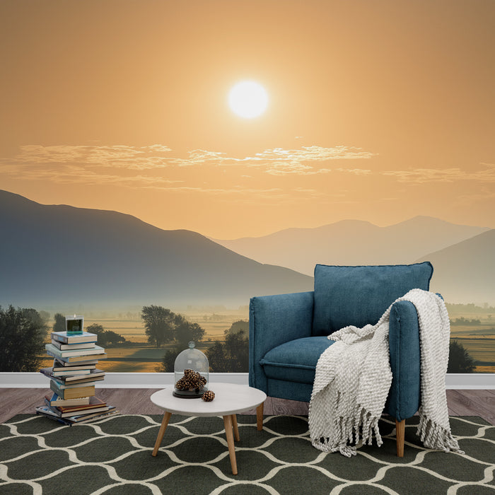 Une pièce de vie accueillante avec un papier peint représentant un paysage montagneux au coucher de soleil, dégageant une atmosphère sereine et chaleureuse.
