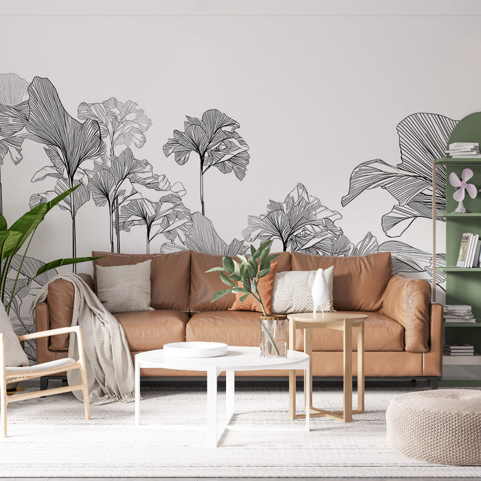 Un salon moderne avec un papier peint représentant des feuilles tropicales en noir et blanc, créant une ambiance artistique et apaisante.