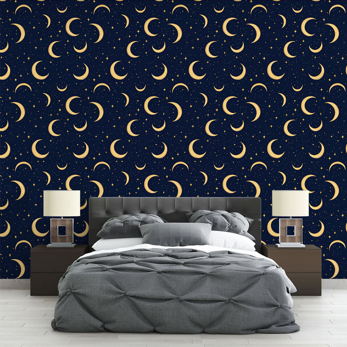 Une chambre moderne avec un papier peint bleu nuit orné de lunes dorées et d'étoiles, créant une atmosphère rêveuse et apaisante.