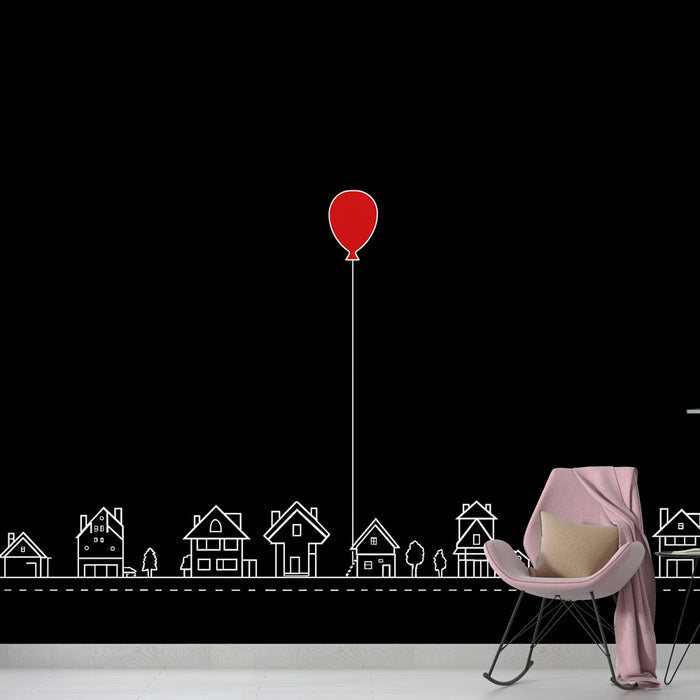 Une chambre moderne avec un papier peint noir illustrant des maisons blanches et un ballon rouge, créant une ambiance ludique et originale.