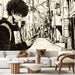 Un salon contemporain avec un papier peint illustratif en noir et blanc représentant un jeune homme dans une ruelle urbaine, créant une ambiance moderne et artistique.