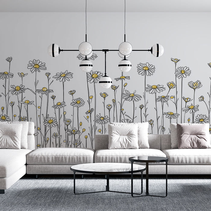 Un salon moderne avec un papier peint floral représentant des marguerites dessinées en noir et blanc, rehaussées de touches jaunes, créant une atmosphère joyeuse et apaisante.