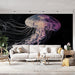 Papier peint méduse avec illustration vibrante de méduse flottante sur fond noir pour salon moderne.