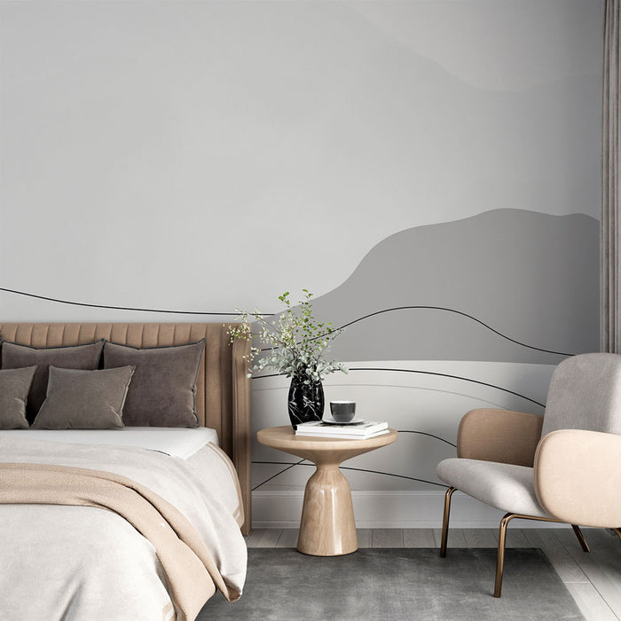 Une chambre moderne avec un papier peint aux nuances de gris et des lignes fluides créant une ambiance apaisante et contemporaine.