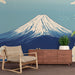 Une pièce moderne avec un papier peint représentant le Mont Fuji stylisé sur fond dégradé bleu, évoquant une atmosphère sereine et inspirante.