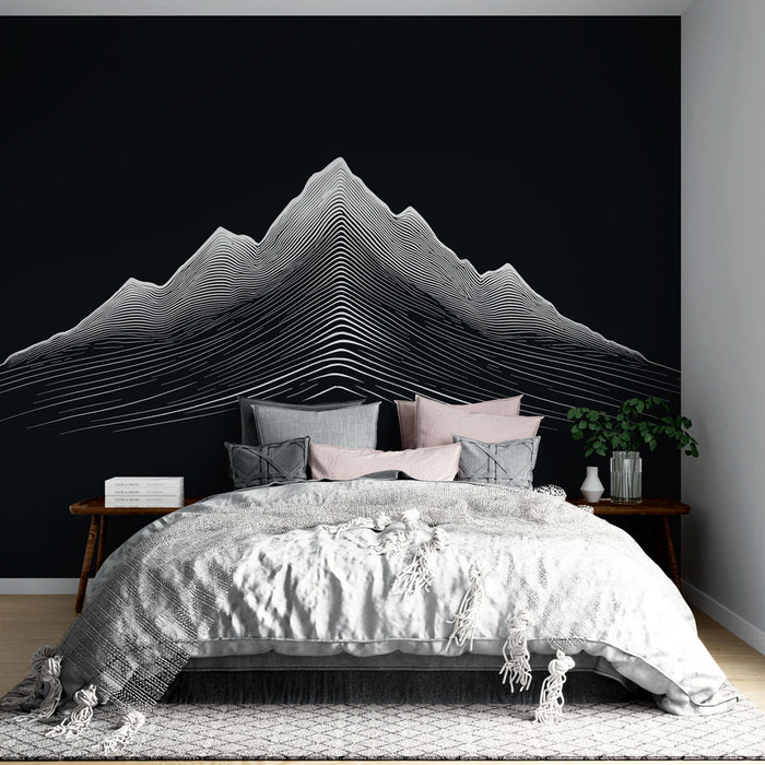 Une chambre moderne avec un papier peint représentant des montagnes stylisées en lignes blanches sur fond noir, créant une ambiance graphique et contemporaine.