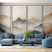 Un salon moderne avec un papier peint représentant des montagnes en dégradés de beige et gris, créant une atmosphère apaisante et naturelle.