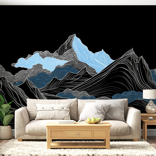 Un salon moderne avec un papier peint représentant des montagnes stylisées en bleu et blanc sur fond noir, créant une atmosphère à la fois dynamique et apaisante.