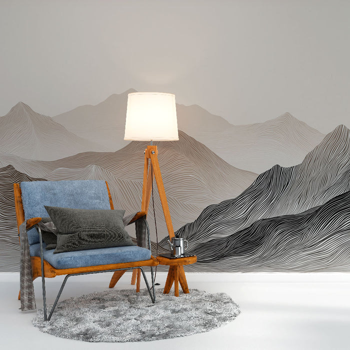 Un salon moderne avec un papier peint représentant des montagnes stylisées en lignes noires et grises, créant une ambiance apaisante et contemporaine.
