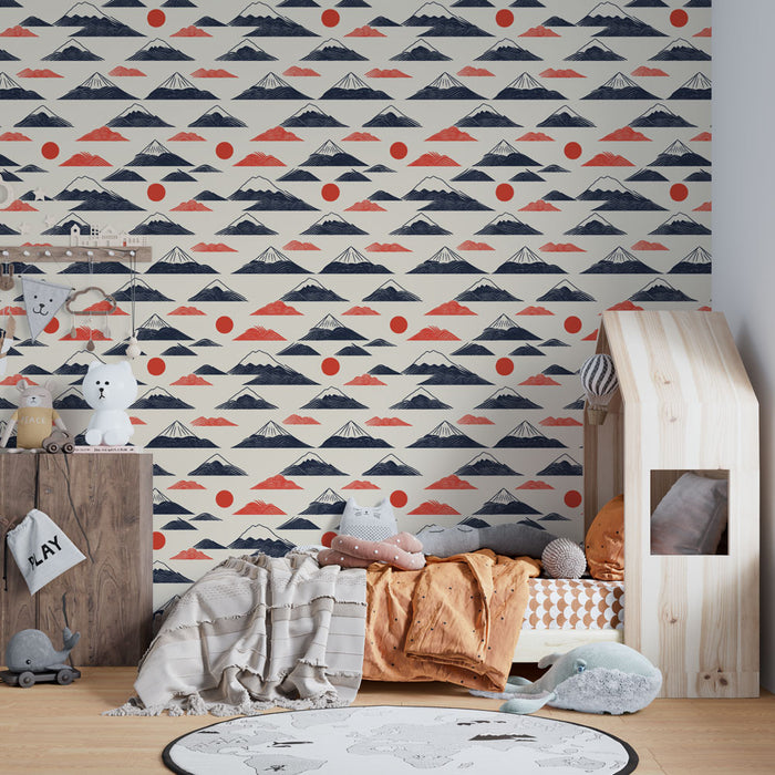 Une chambre d'enfant avec un papier peint représentant des montagnes stylisées en bleu et rouge sur fond crème, créant une ambiance ludique et apaisante.