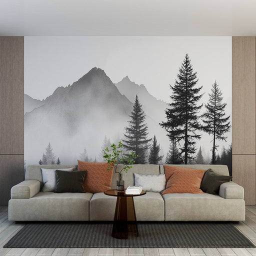 Un salon moderne avec un papier peint représentant des montagnes en noir et blanc, évoquant une atmosphère calme et naturelle, agrémenté de silhouettes d'arbres majestueux.