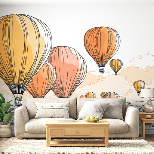 Une salle de séjour lumineuse avec un papier peint illustrant des montgolfières aux teintes orangées et jaunes, créant une atmosphère joyeuse et aérienne.