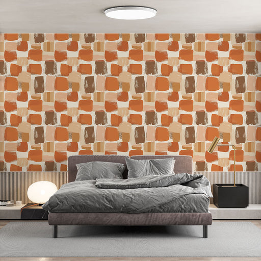 Une chambre moderne avec un papier peint aux motifs géométriques de carrés en nuances de terracotta et beige, créant une atmosphère chaleureuse et accueillante.