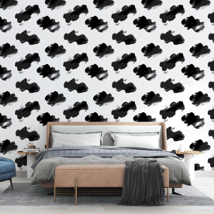 Une chambre moderne avec un papier peint graphique noir et blanc, présentant des motifs de coups de pinceau qui apportent une touche artistique et dynamique.