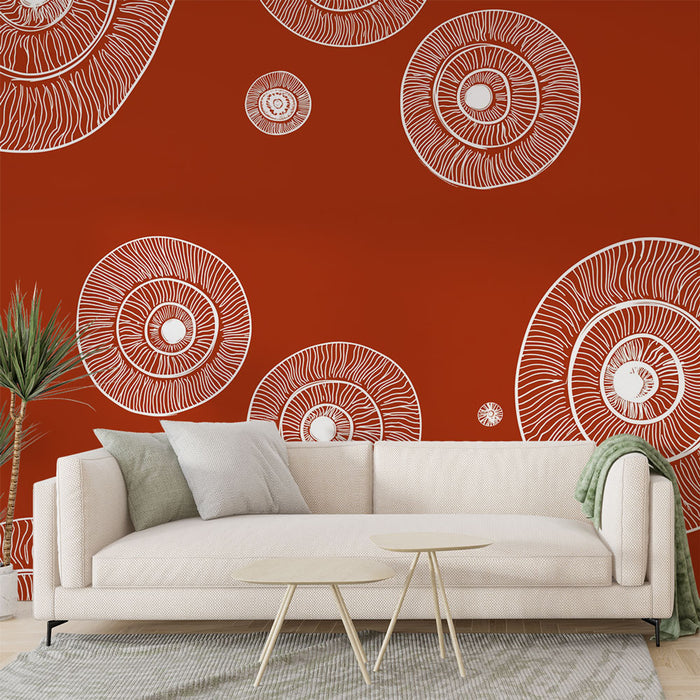 Un salon moderne avec un papier peint rouge orné de motifs circulaires blancs évoquant une ambiance artistique et dynamique.