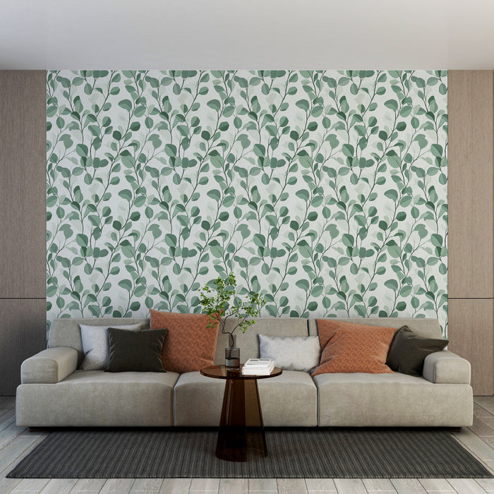 Un salon contemporain avec un papier peint aux motifs de feuilles vertes sur fond clair, créant une ambiance fraîche et apaisante.
