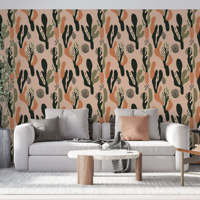 Un salon moderne avec un papier peint aux motifs organiques et colorés, mêlant des teintes de vert, orange et noir sur fond rose, créant une ambiance chaleureuse et accueillante.