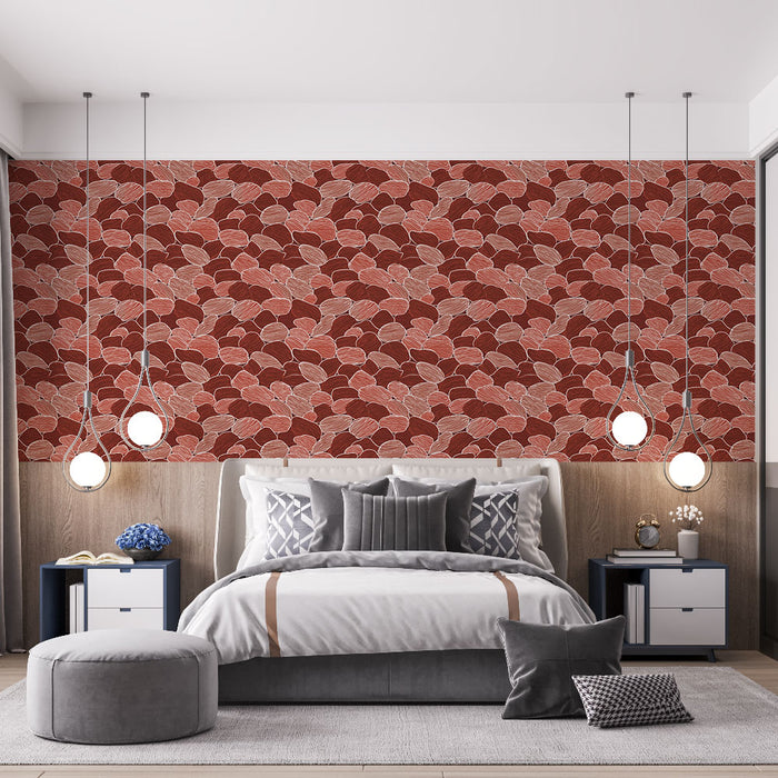 Une chambre moderne avec un papier peint aux motifs de feuilles stylisées dans des teintes rouge et beige, créant une ambiance chaleureuse et accueillante.