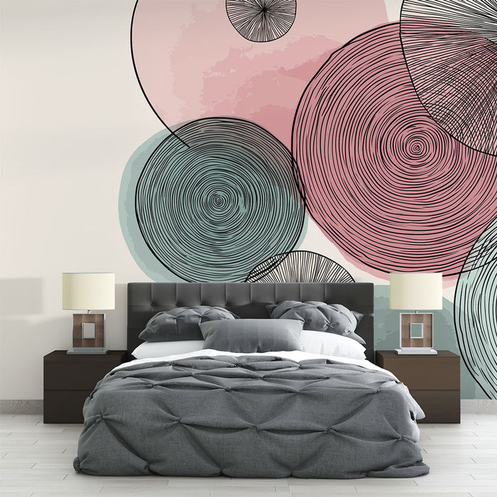 Une chambre moderne avec un papier peint abstrait aux cercles colorés rose, vert et noir, créant une ambiance artistique et dynamique.