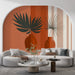 Un salon moderne avec un papier peint graphique aux teintes terracotta et beige, mettant en valeur des vases stylisés et des feuilles tropicales, créant une ambiance chaleureuse et contemporaine.