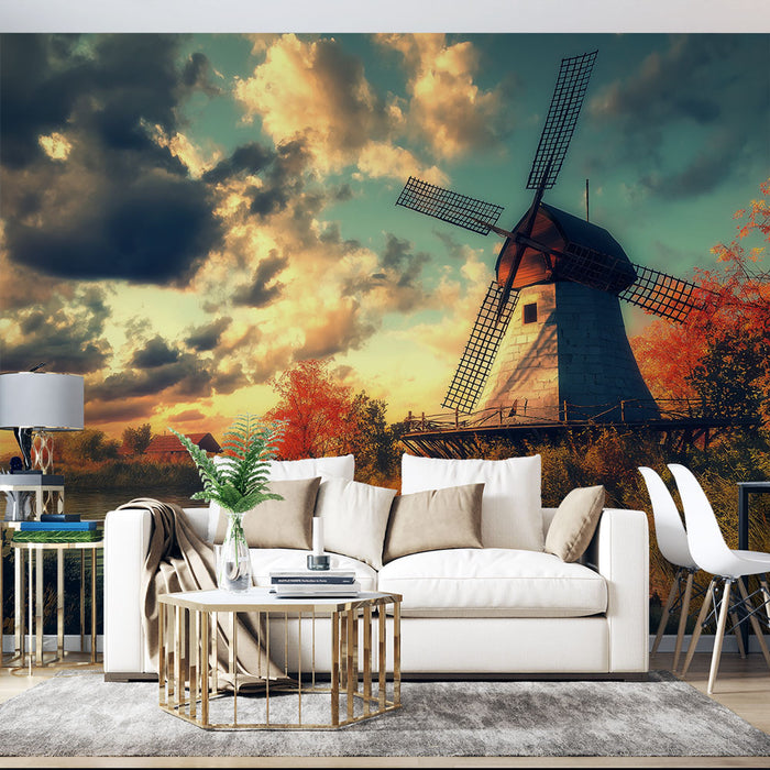 Une pièce de salon avec un papier peint représentant un moulin à vent sous un ciel nuageux aux teintes dorées et orangées, créant une atmosphère chaleureuse et nostalgique.