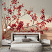 Une chambre moderne avec un papier peint floral aux motifs de branches et baies rouges sur fond beige, créant une atmosphère chaleureuse et apaisante.