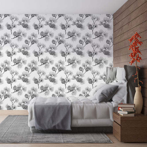 Une chambre moderne avec un papier peint noir et blanc représentant des branches et des cônes de pin, créant une atmosphère élégante et naturelle.