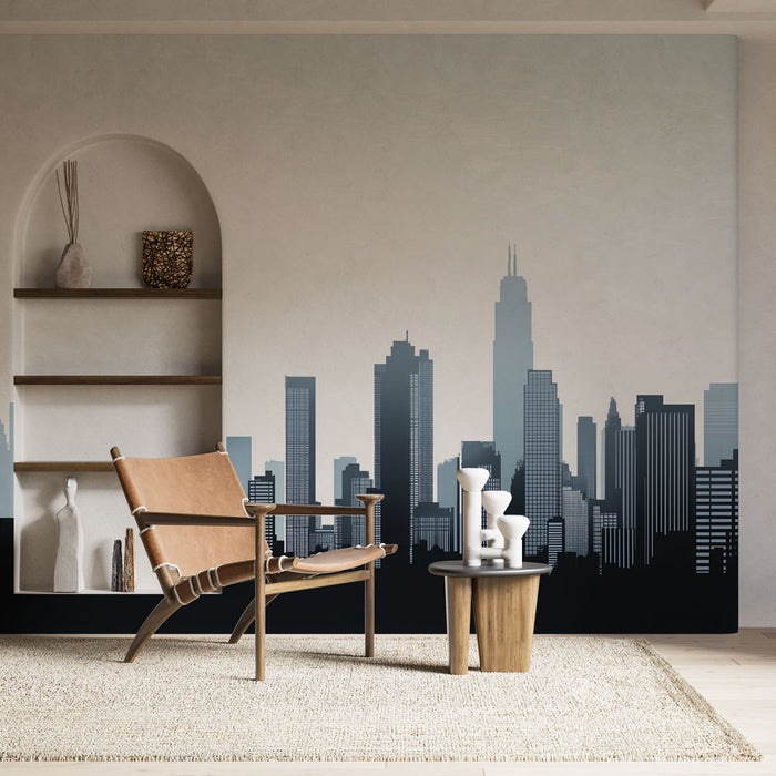 Une pièce moderne avec un papier peint représentant une silhouette de skyline urbaine en dégradé de bleu et noir, créant une ambiance contemporaine et dynamique.