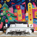 Papier peint Noël coloré avec scène festive, sapin et maisons vibrantes pour chambre moderne.